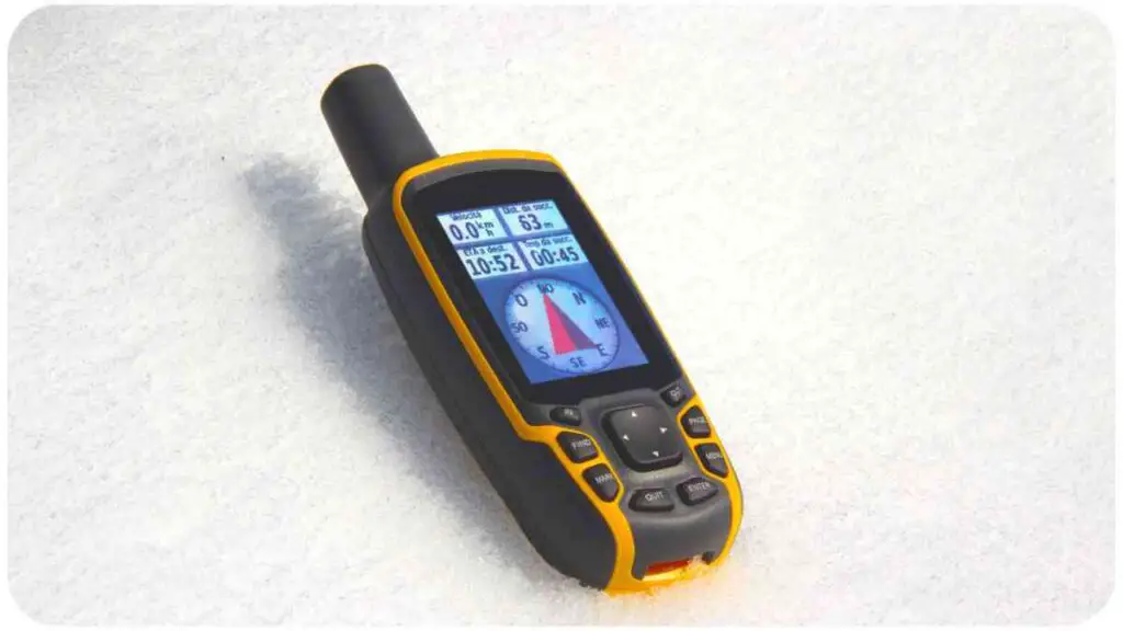 a gps device laying in the snow.